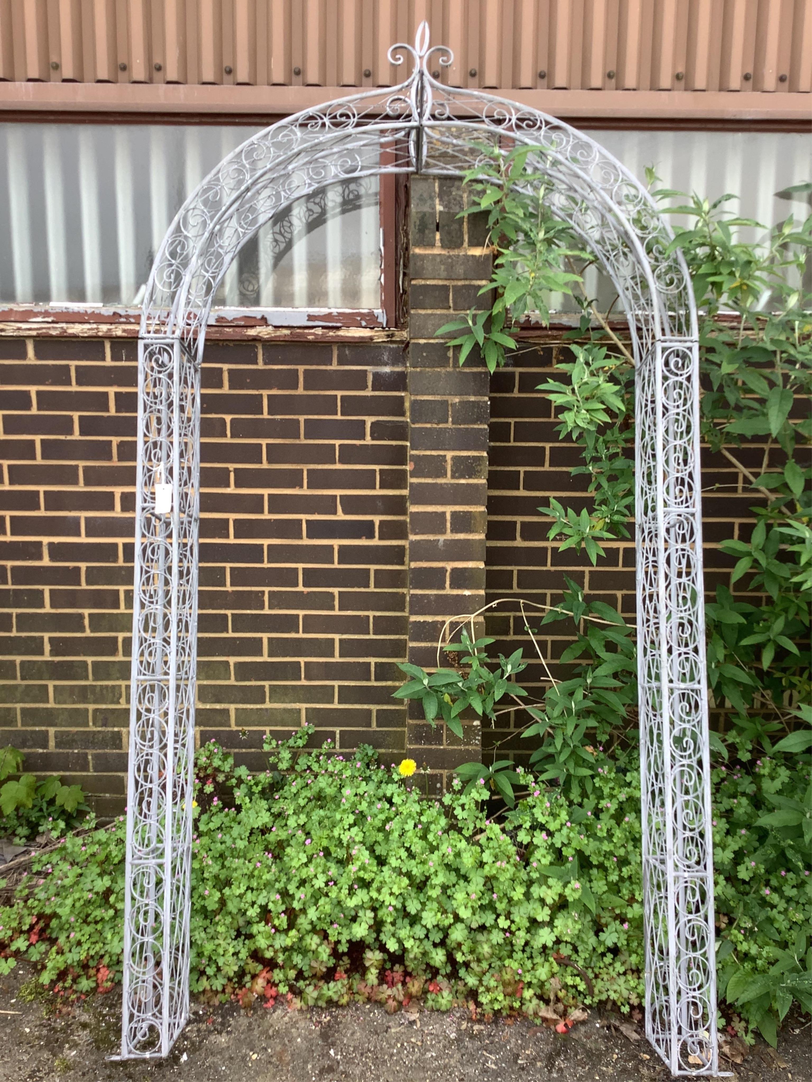 A painted metal garden arch, width 132cm, height 240cm